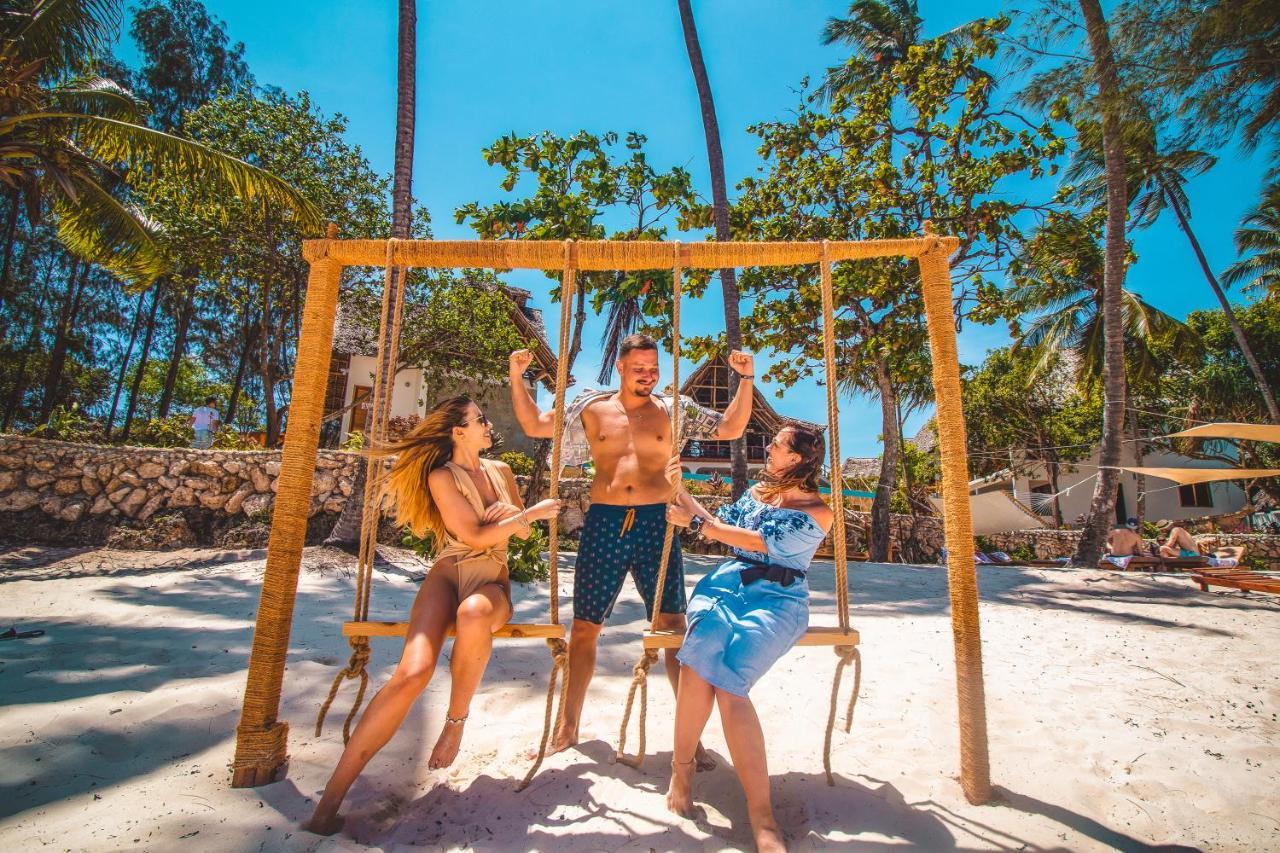 Zanzibella Hotel & Spa Кивенгва Экстерьер фото Swinging at the beach