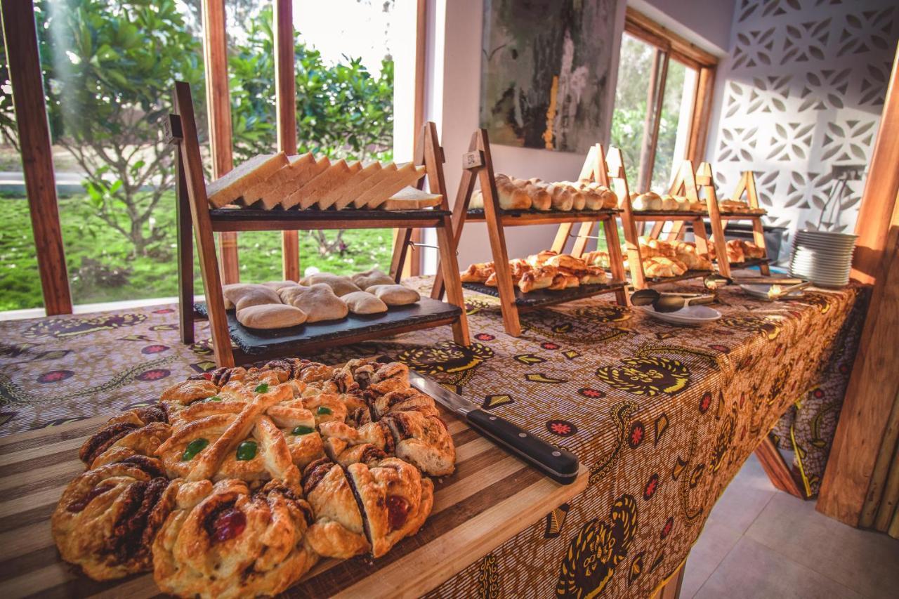 Zanzibella Hotel & Spa Кивенгва Экстерьер фото A selection of pastries at a buffet
