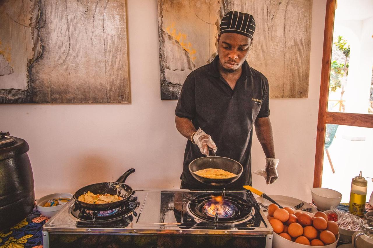 Zanzibella Hotel & Spa Кивенгва Экстерьер фото A chef cooking